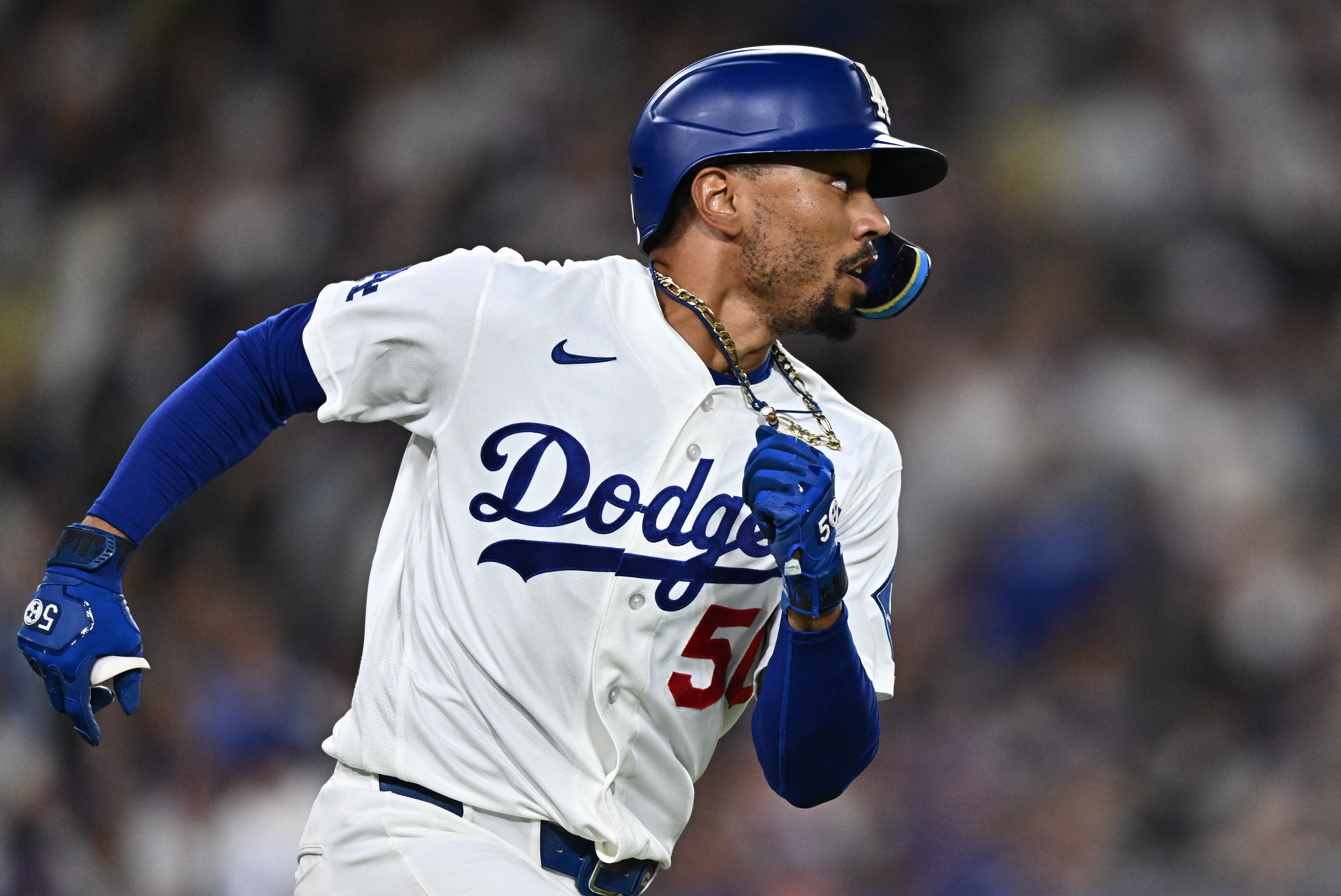 Dodgers shortstop Mookie Betts (50) hits a double as we break down our Dodgers vs. Giants prediction.