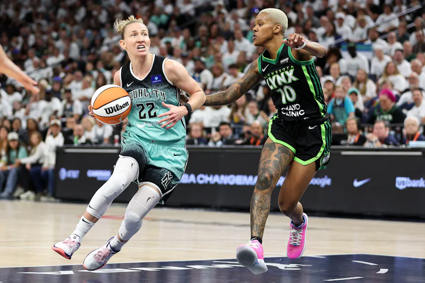 New York Liberty guard Courtney Vandersloot works around Minnesota Lynx guard Courtney Williams as we look at the Flutter report on sports betting growth due to the rise of women's sports