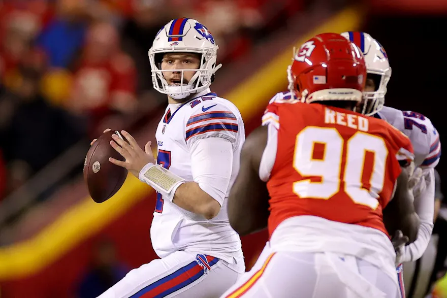 Josh Allen of the Buffalo Bills looks to pass against the Kansas City Chiefs during the first quarter in the AFC Divisional Playoff game at Arrowhead Stadium on January 23, 2022 in Kansas City, Missouri.