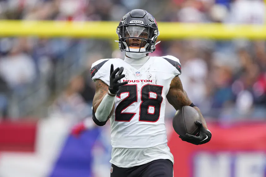 Houston Texans running back Joe Mixon runs with the ball against the New England Patriots during the first half as we look at our Texans vs. Chiefs prediction.