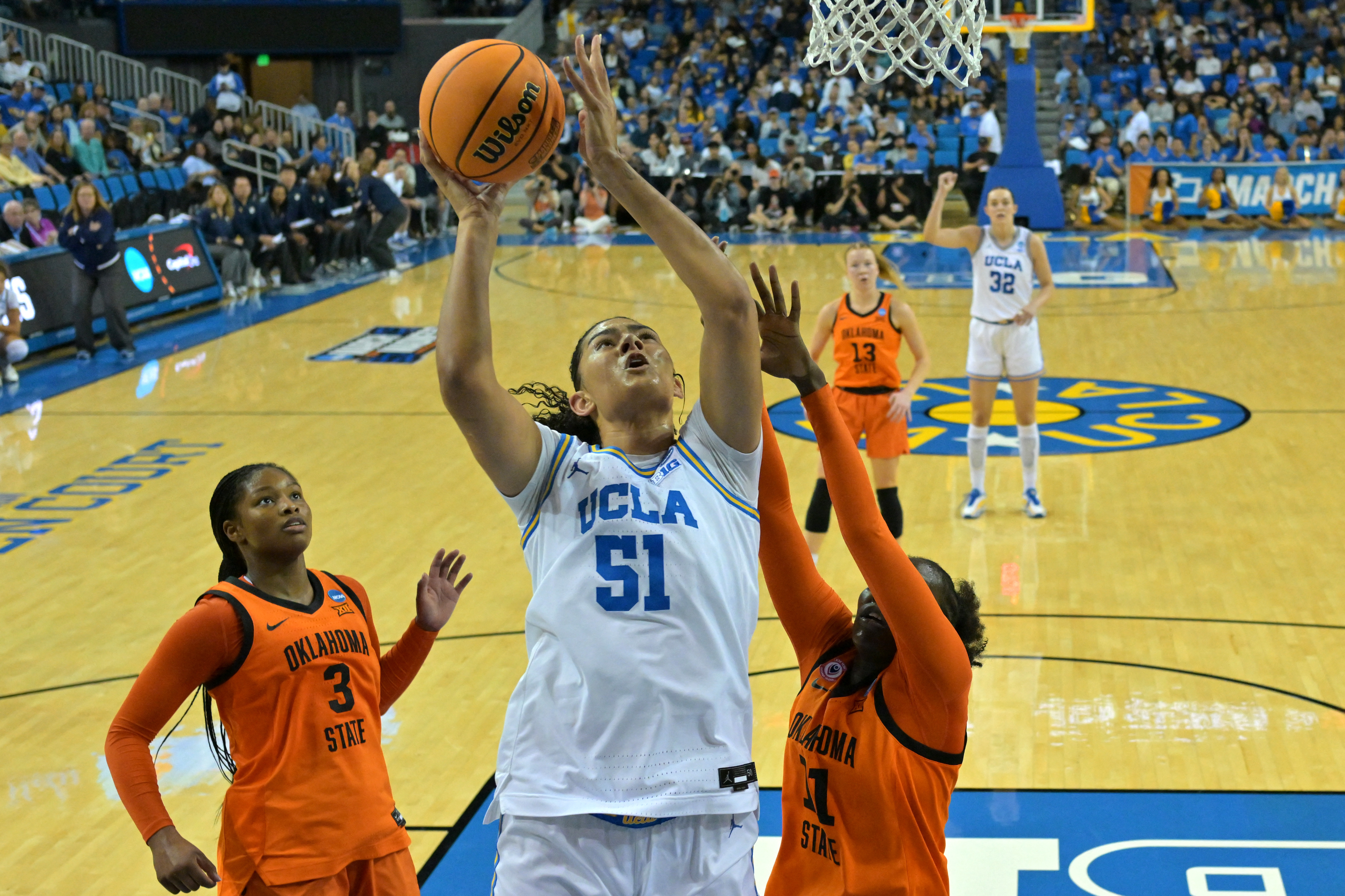 UCLA's Lauren Betts (51) leads a Bruins team that's among the programs focused on in our women's March Madness predictions. 