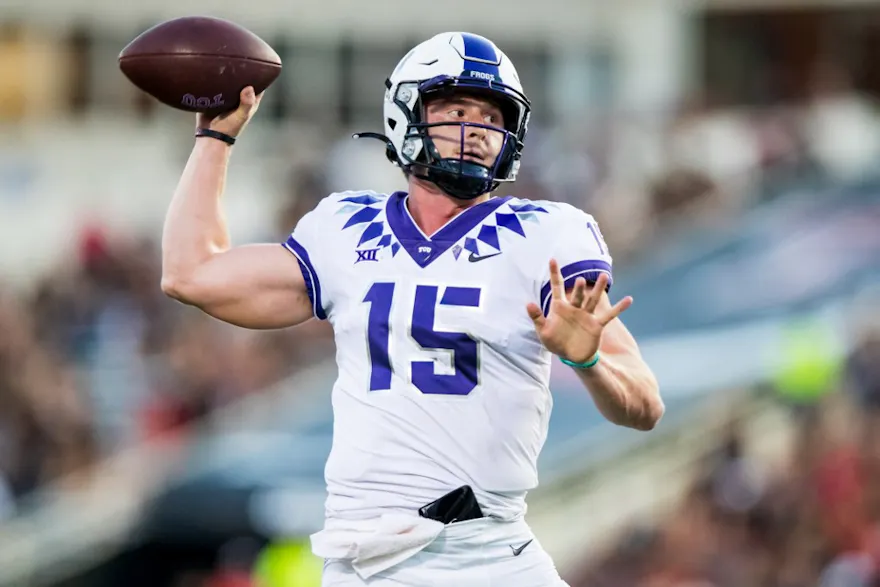 Quarterback Max Duggan of the TCU Horned Frogs passes the ball during the first half of the college football game against the Texas Tech Red Raiders.