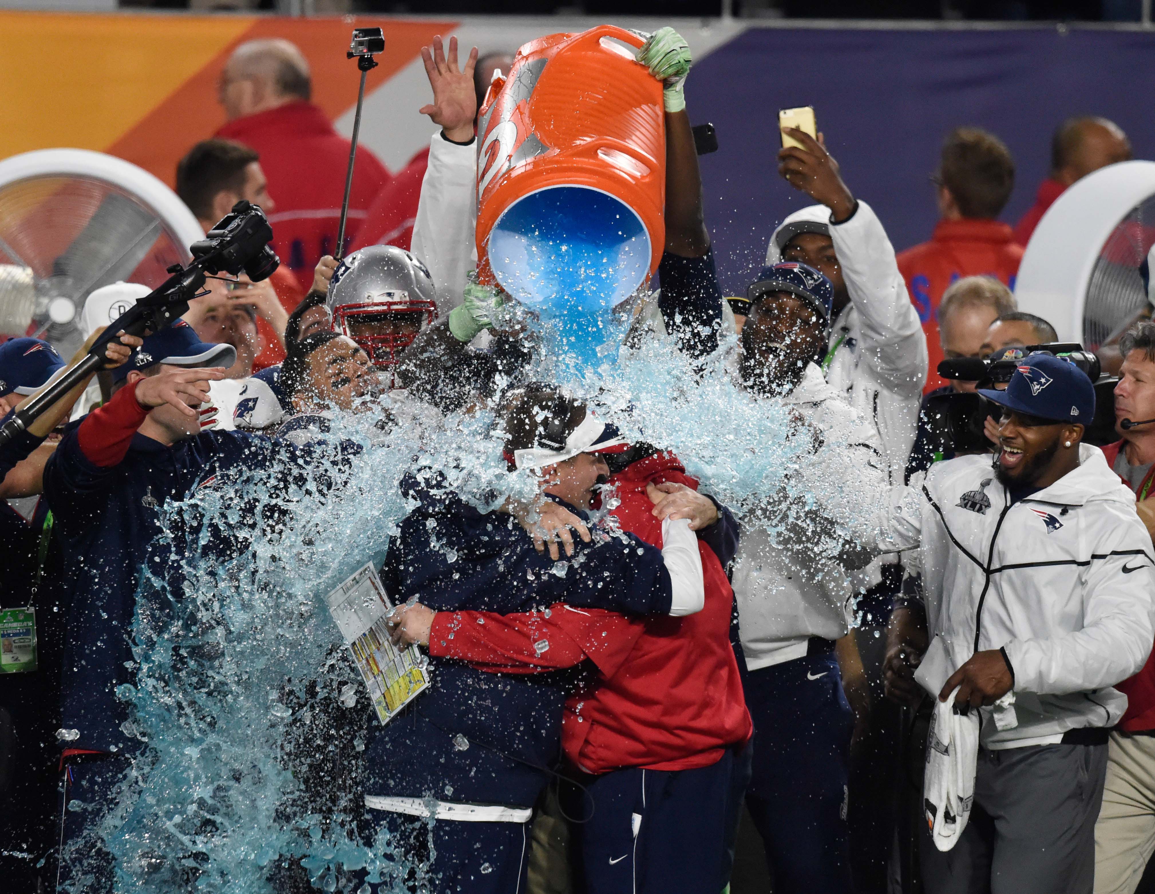 New England Patriots offensive coordinator Josh McDaniels former head coach Bill Belichick are dunked with Gatorade as we look at how to bet the Super Bowl 60 Gatorade color. 