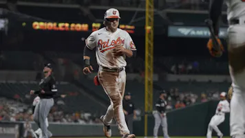 Gunnar Henderson #2 of the Baltimore Orioles scores on a single as we look at the best MLB Rookie of the Year odds