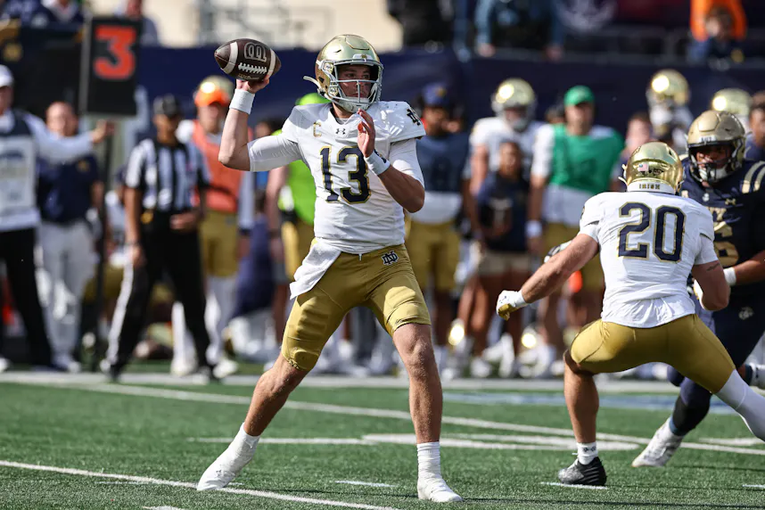 Notre Dame Fighting Irish quarterback Riley Leonard throws the ball during the first half against the Navy Midshipmen as we offer our Florida State vs. Notre Dame prediction.