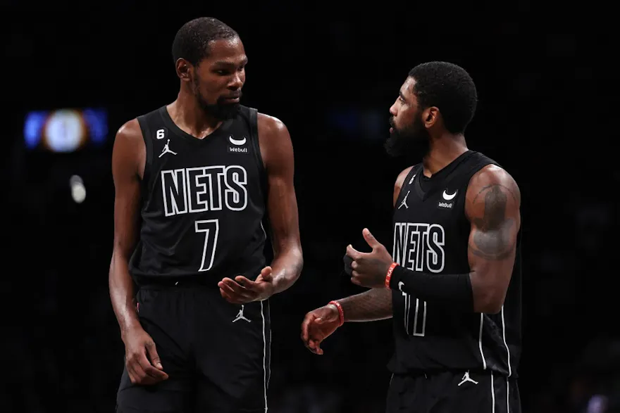 Kyrie Irving and Kevin Durant of the Brooklyn Nets talk during a break in the action during the fourth quarter of the game against the Indiana Pacers at Barclays Center on October 31, 2022 in New York City.