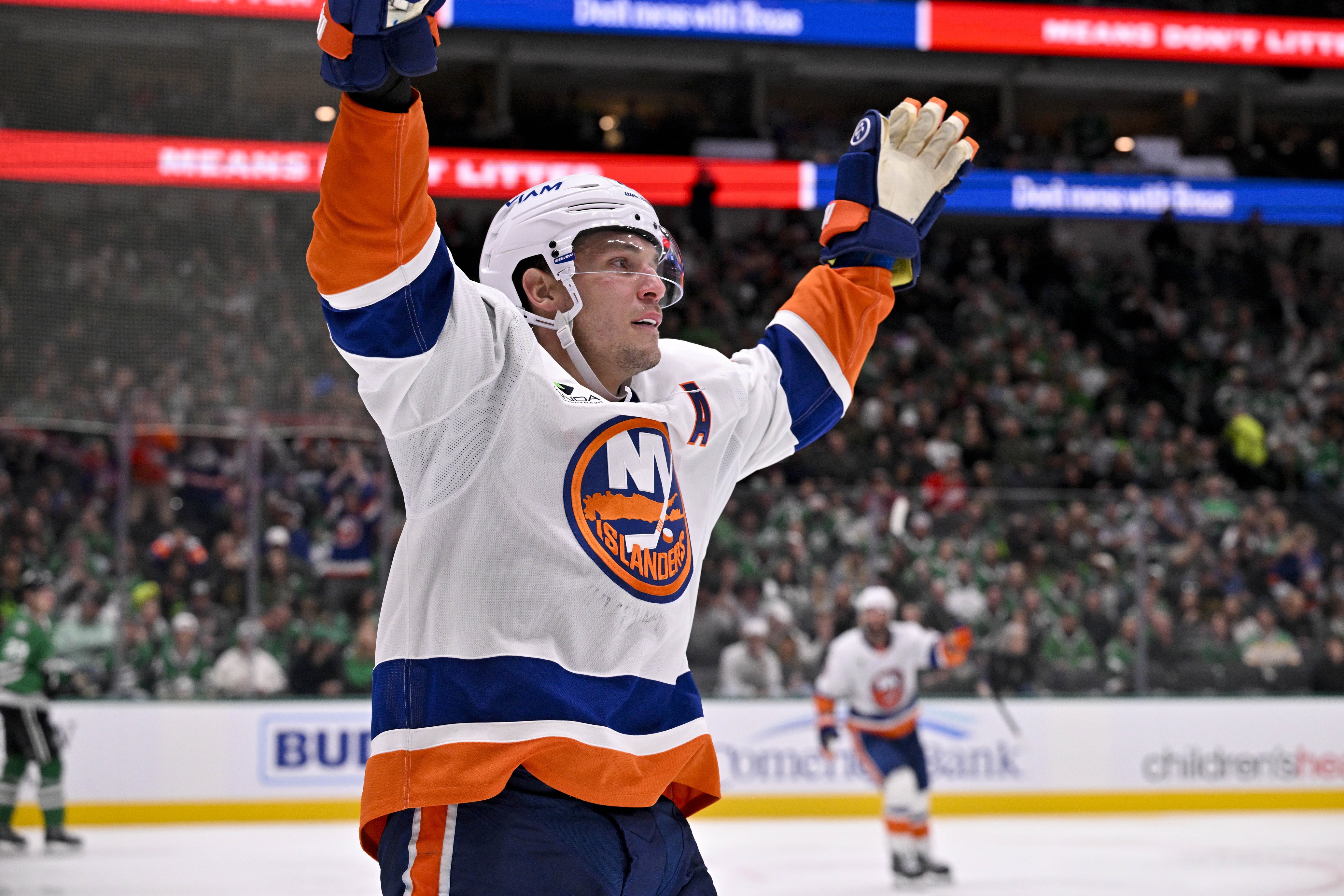 New York Islanders center Bo Horvat (14), seen here celebrating after scoring a goal, is featured in our Mammoth vs. Islanders player props.