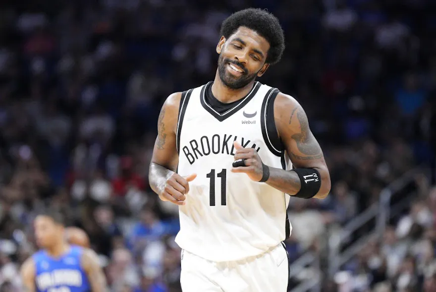 Kyrie Irving of the Brooklyn Nets reacts after scoring against the Orlando Magic in the second half at Amway Center on March 15, 2022 in Orlando, Florida. Photo by Mark Brown/Getty Images via AFP.