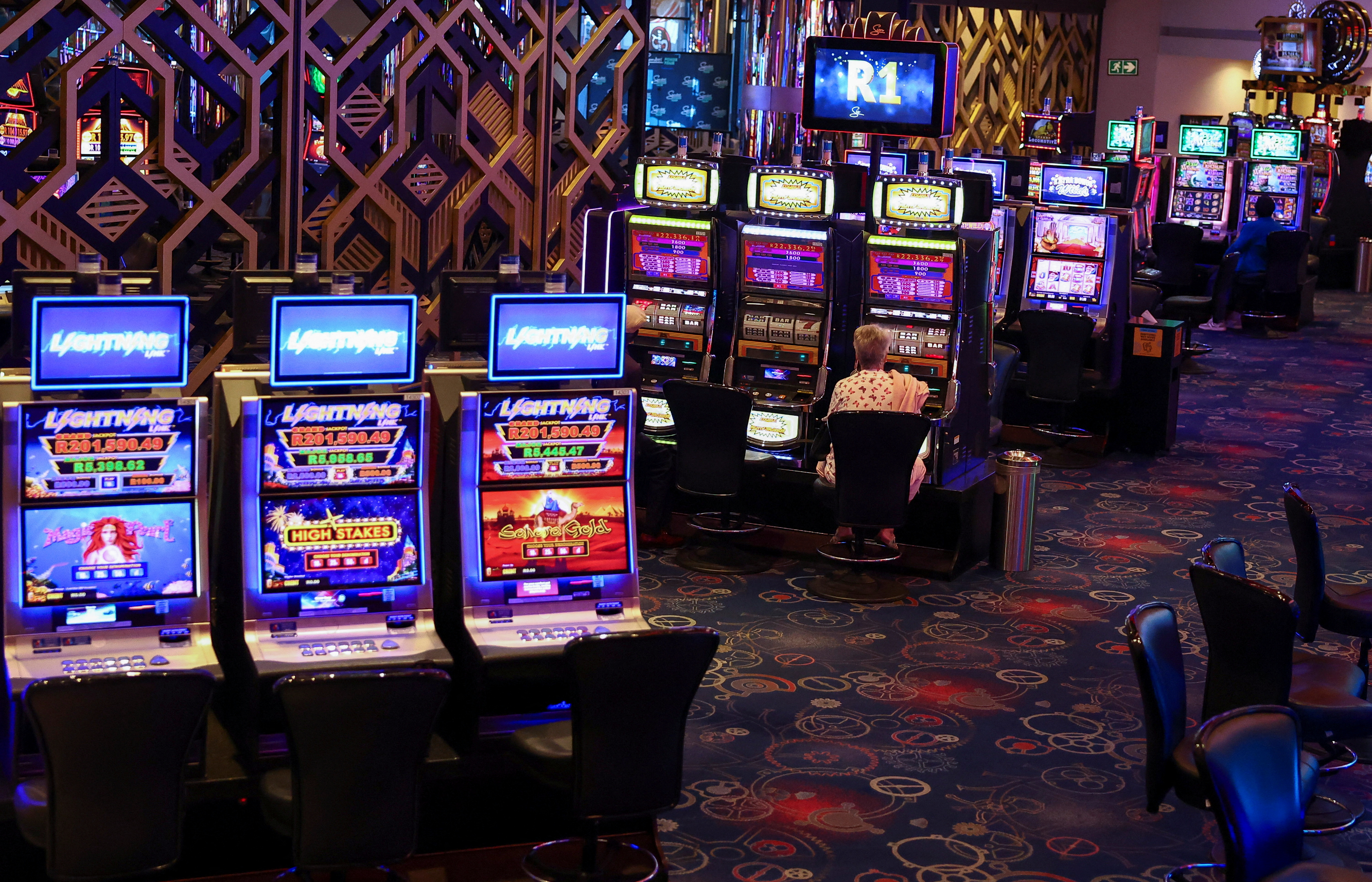 Patron plays a row of slot machines as we look at Iowa looking to regulate sweepstakes casinos.