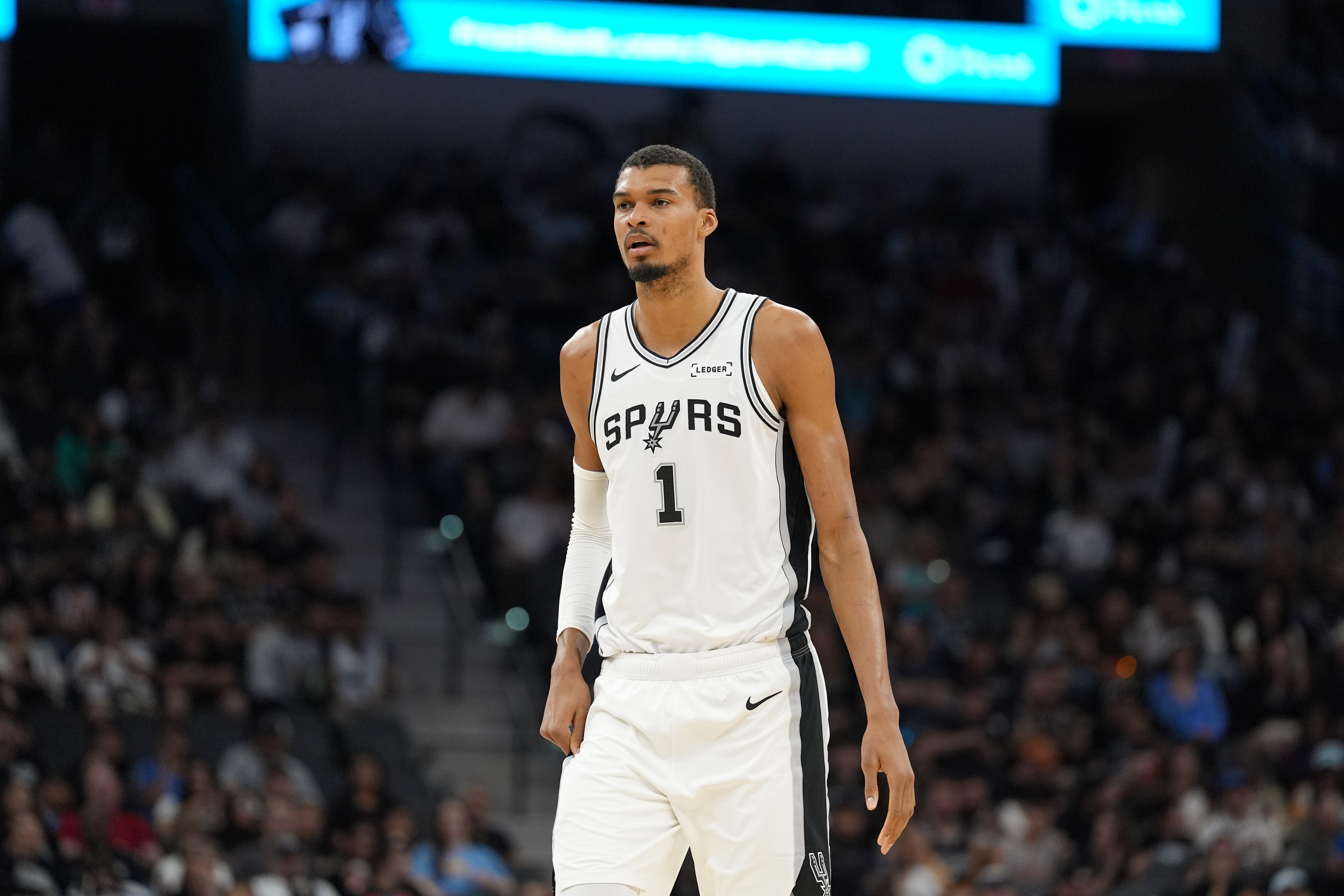 San Antonio Spurs forward Victor Wembanyama (1), seen here looking on, is featured in our NBA player props today.