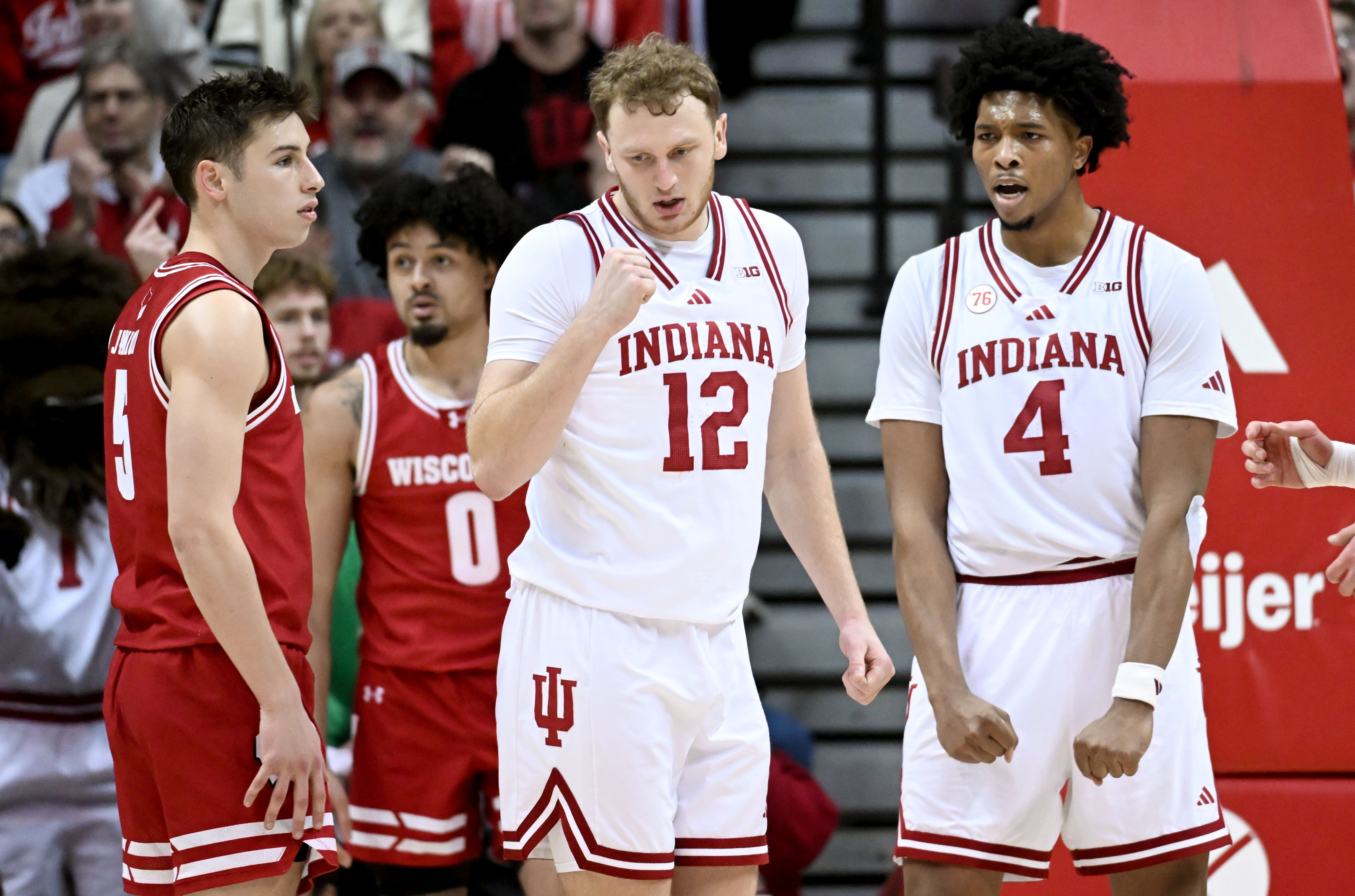 Indiana Hoosiers forward Tucker DeVries and Indiana Hoosiers forward Sam Alexis celebrate after a play as we look at our college basketball best bets.