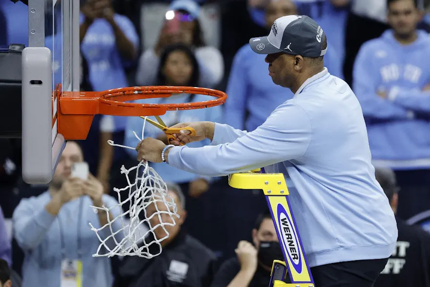 Head coach Hubert Davis of the North Carolina Tar Heels cuts the net after defeating the St. Peter's Peacocks, 69-49, in the Elite Eight round game of the 2022 NCAA Men's Basketball Tournament at Wells Fargo Center on March 27, 2022 in Philadelphia, Penns