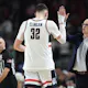 Donovan Clingan and head coach Dan Hurley of the UConn Huskies celebrate against the Alabama Crimson Tide in the NCAA Men's Basketball Tournament. We're breaking down the Huskies in our national championship odds, injuries & last minute news for bettors.