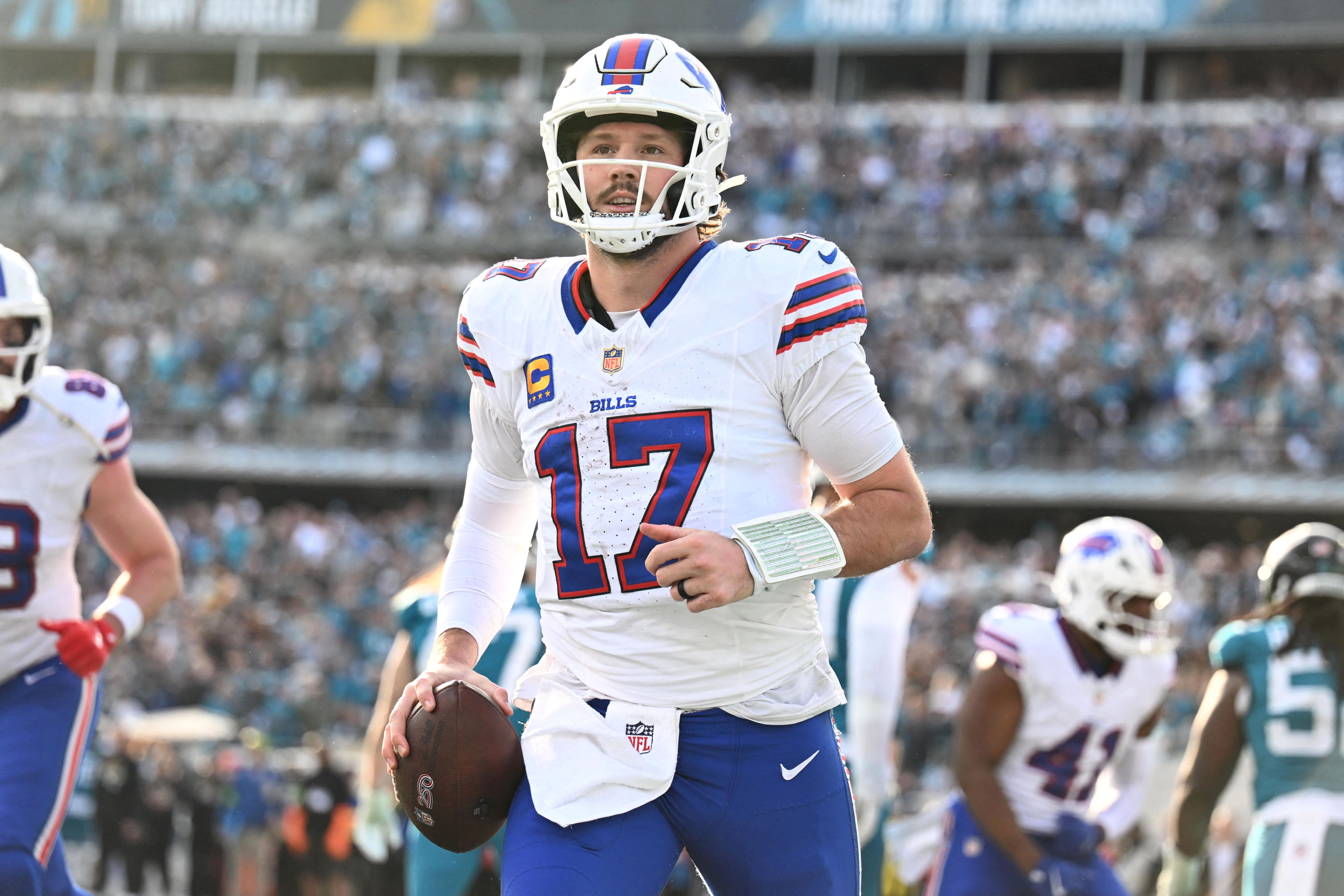 Buffalo Bills quarterback Josh Allen (17), seen here reacting after scoring a touchdown, is featured in our Bills vs. Broncos player props and best bets for the NFL Divisional Round.