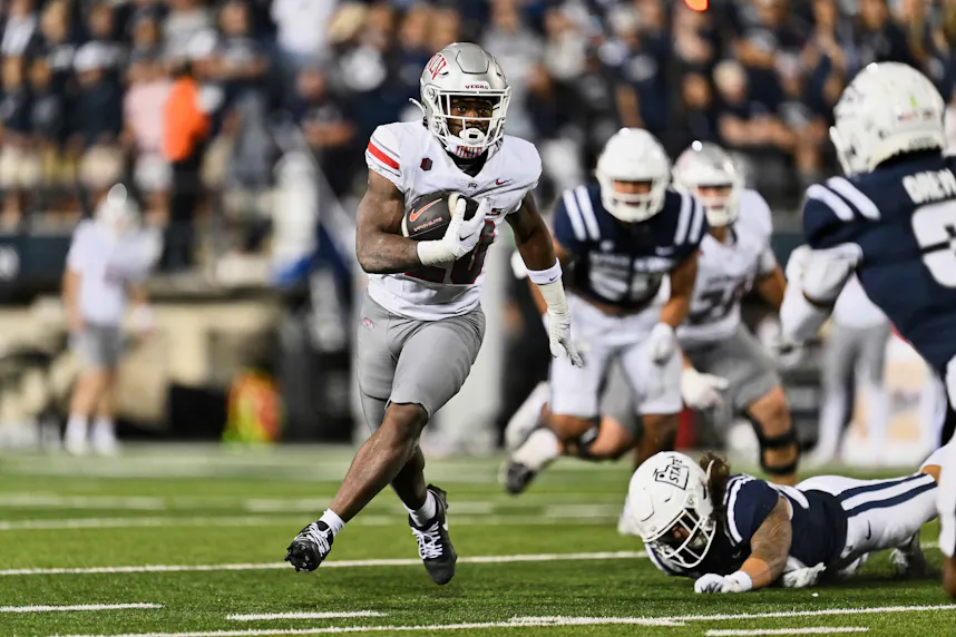 UNLV Rebels running back Kylin James runs with the ball against the Utah State Aggies.