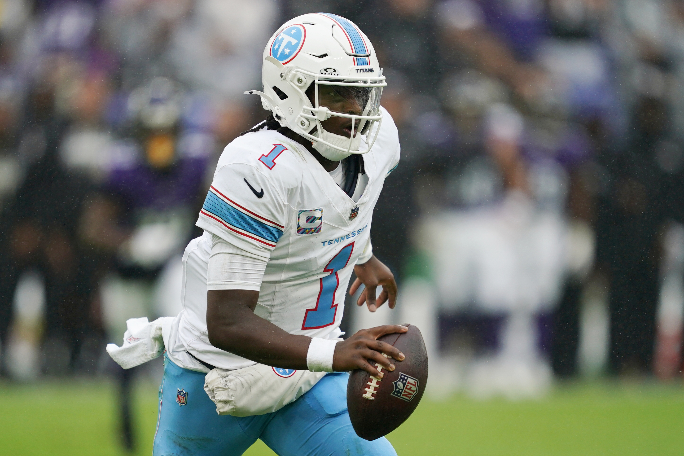 Titans quarterback Cam Ward (1) runs with the ball as we break down our Texans vs. Titans prediction.