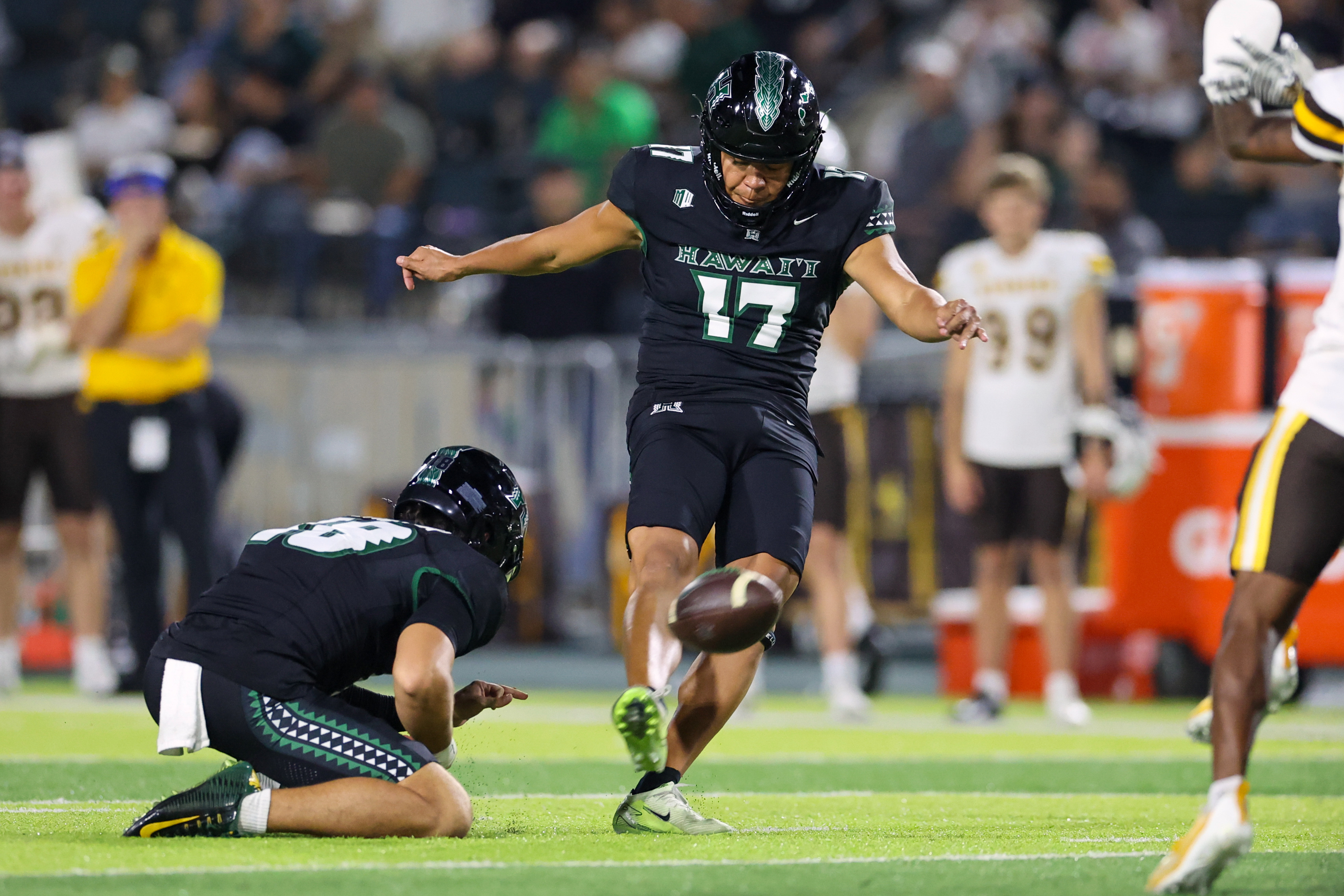 Hawaii kicker Kansei Matsuzawa in action as we look at the college football bowl game odds and schedule.