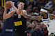 Nikola Jokic (15) of the Denver Nuggets pulls down a rebound against Nickeil Alexander-Walker (9) of the Minnesota Timberwolves, as we offer our best Nuggets vs. Timberwolves player props for Friday's Game 3 at Target Center in Minneapolis.