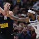 Nikola Jokic (15) of the Denver Nuggets pulls down a rebound against Nickeil Alexander-Walker (9) of the Minnesota Timberwolves, as we offer our best Nuggets vs. Timberwolves player props for Friday's Game 3 at Target Center in Minneapolis.