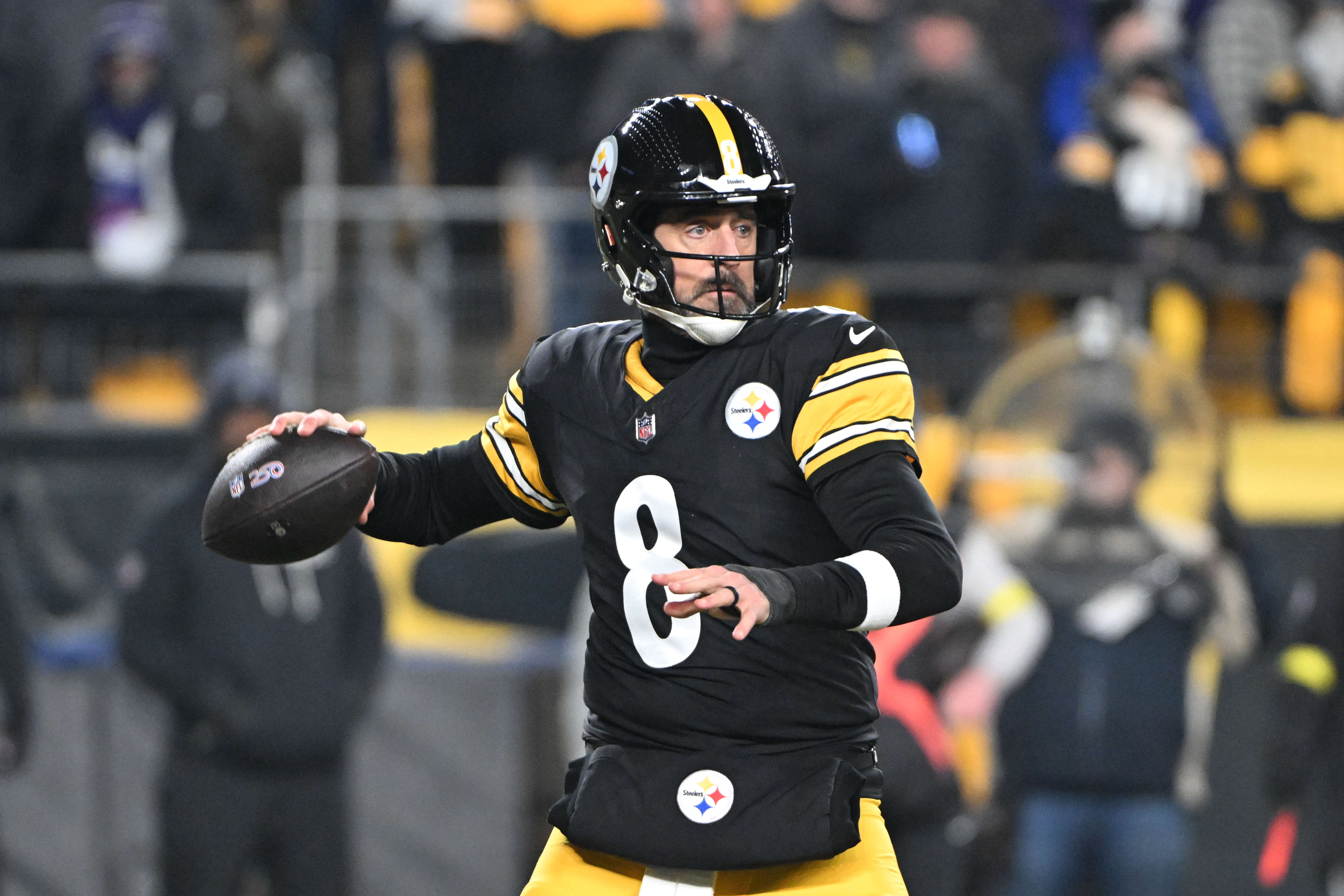 Pittsburgh Steelers quarterback Aaron Rodgers drops back to pass as we make our best Texans vs. Steelers predictions