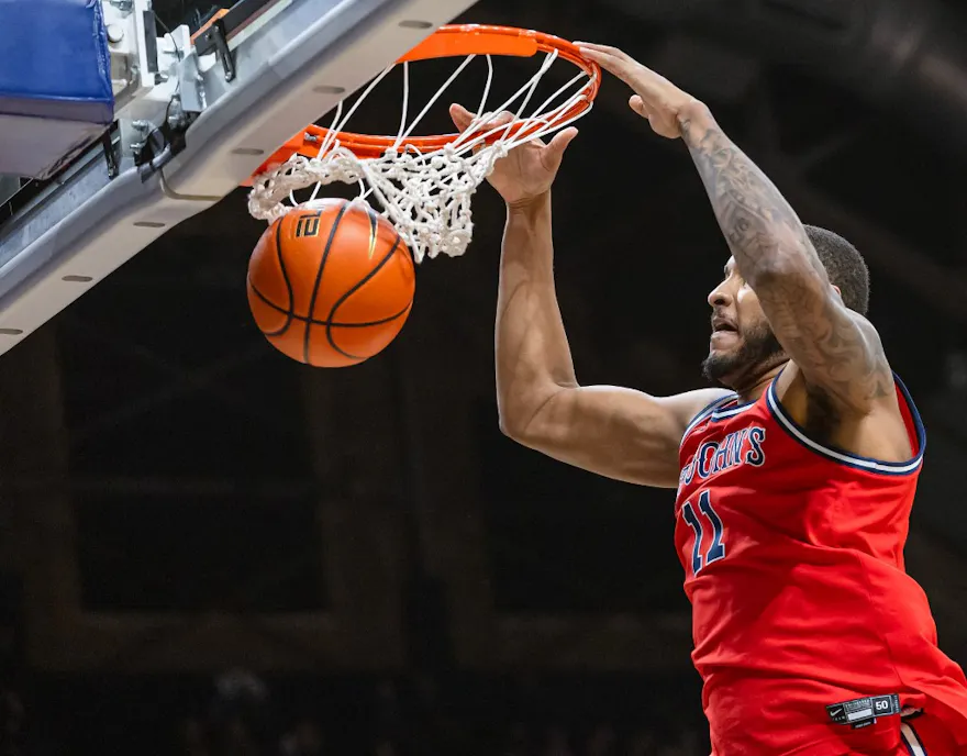 Joel Soriano #11 of the St. John's Red Storm dunks the ball as we look at our college basketball player props & best bets for Friday