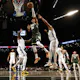Giannis Antetokounmpo of the Milwaukee Bucks shoots against Nic Claxton of the Brooklyn Nets at Barclays Center on Feb. 28, 2023 in New York City.