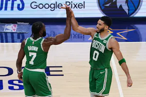 Jaylen Brown of the Boston Celtics and Jayson Tatum of the Boston Celtics high five during Game 4 of the Eastern Conference Finals. We're looking at our NBA Finals Predictions & Best Bets for Celtics Fans. 