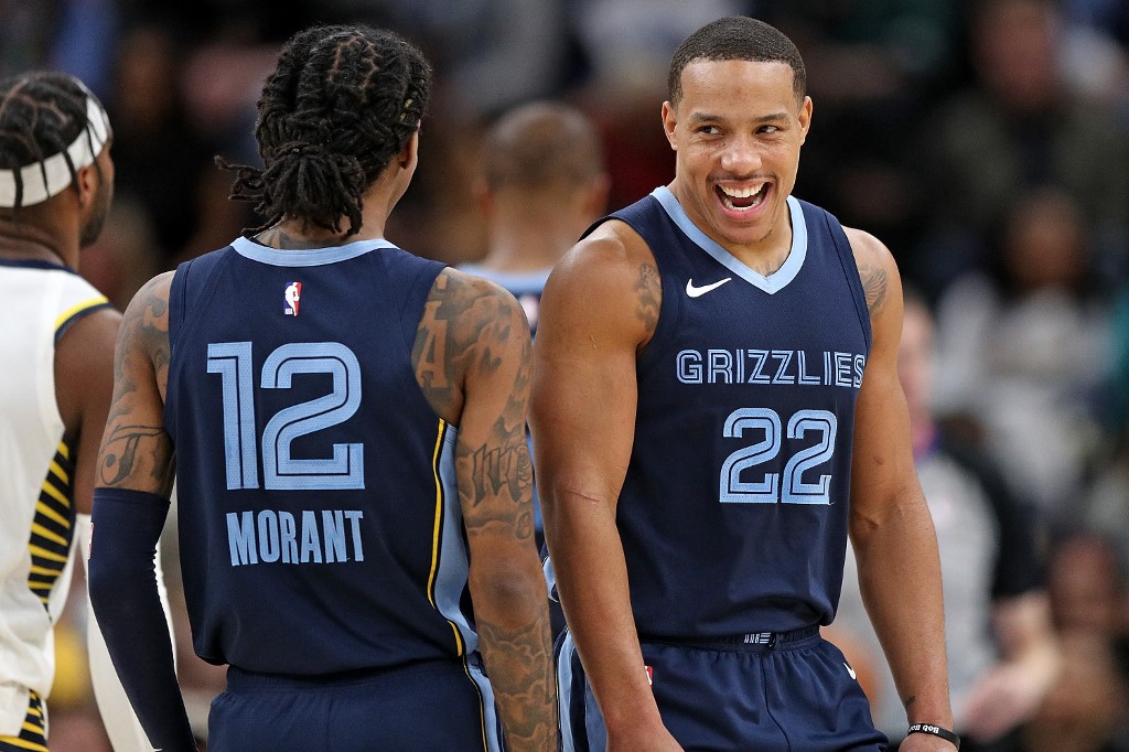 Ja Morant #12 of the Memphis Grizzlies and Desmond Bane #22 react as we make our Grizzlies vs. Mavericks player props picks and predictions ahead of Tuesday's game, the first since news broke of Morant's season-ending injury.