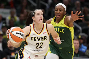 Caitlin Clark of the Indiana Fever drives to the basket against the Seattle Storm, as we offer our best Storm vs. Fever prediction and expert picks for Thursday's WNBA game at Gainbridge Fieldhouse in Indianapolis.