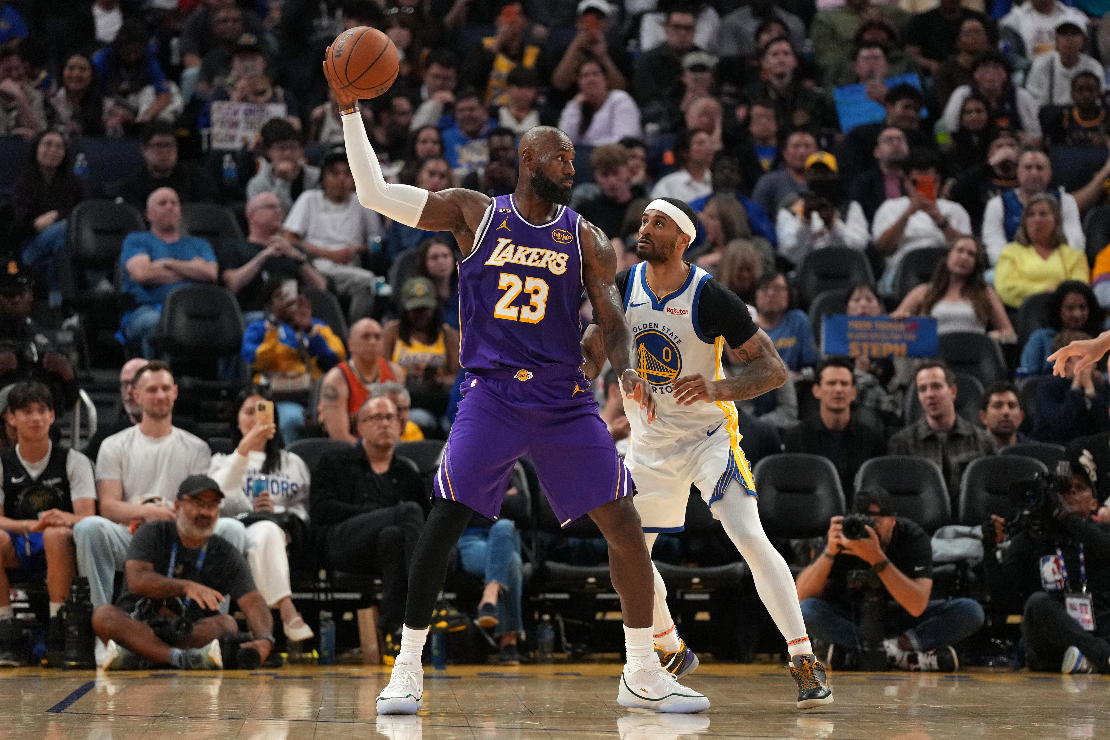 Los Angeles Lakers forward LeBron James (23) holds onto the ball as we break down our NBA Play of the Day.