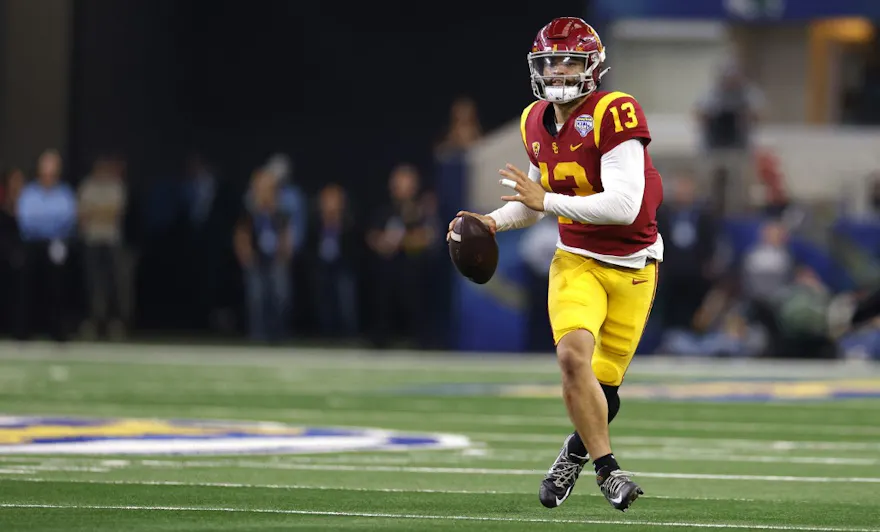 Caleb Williams of the USC Trojans looks to throw against the Tulane Green Wave in the first half of the Goodyear Cotton Bowl Classic on January 2, 2023 at AT&T Stadium in Arlington, Texas.
