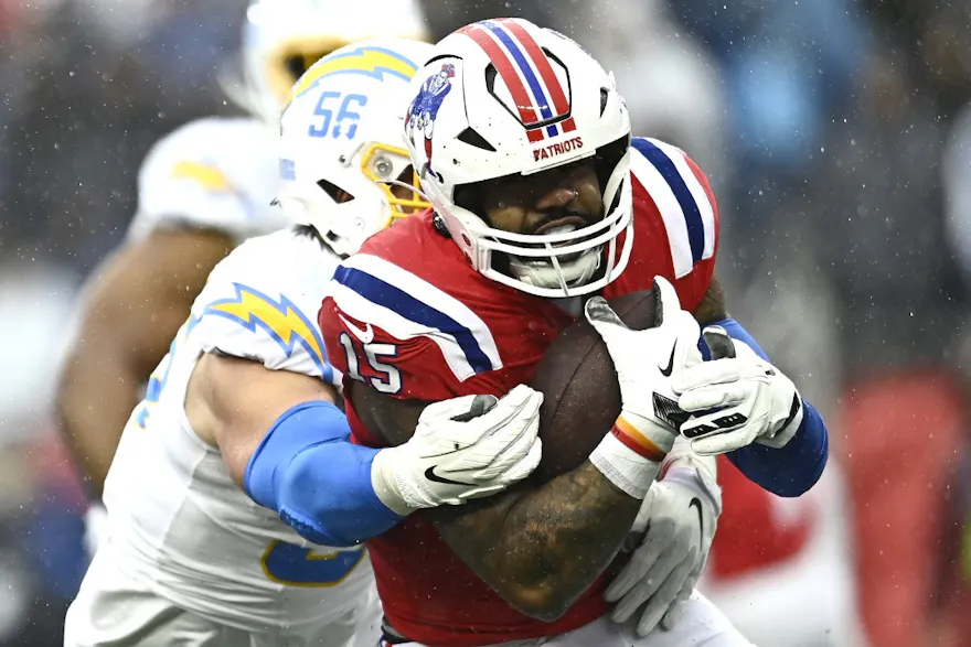 Ezekiel Elliott of the New England Patriots carries the ball during the game against the Los Angeles Chargers, and we offer new U.S. bettors our exclusive BetMGM bonus code.