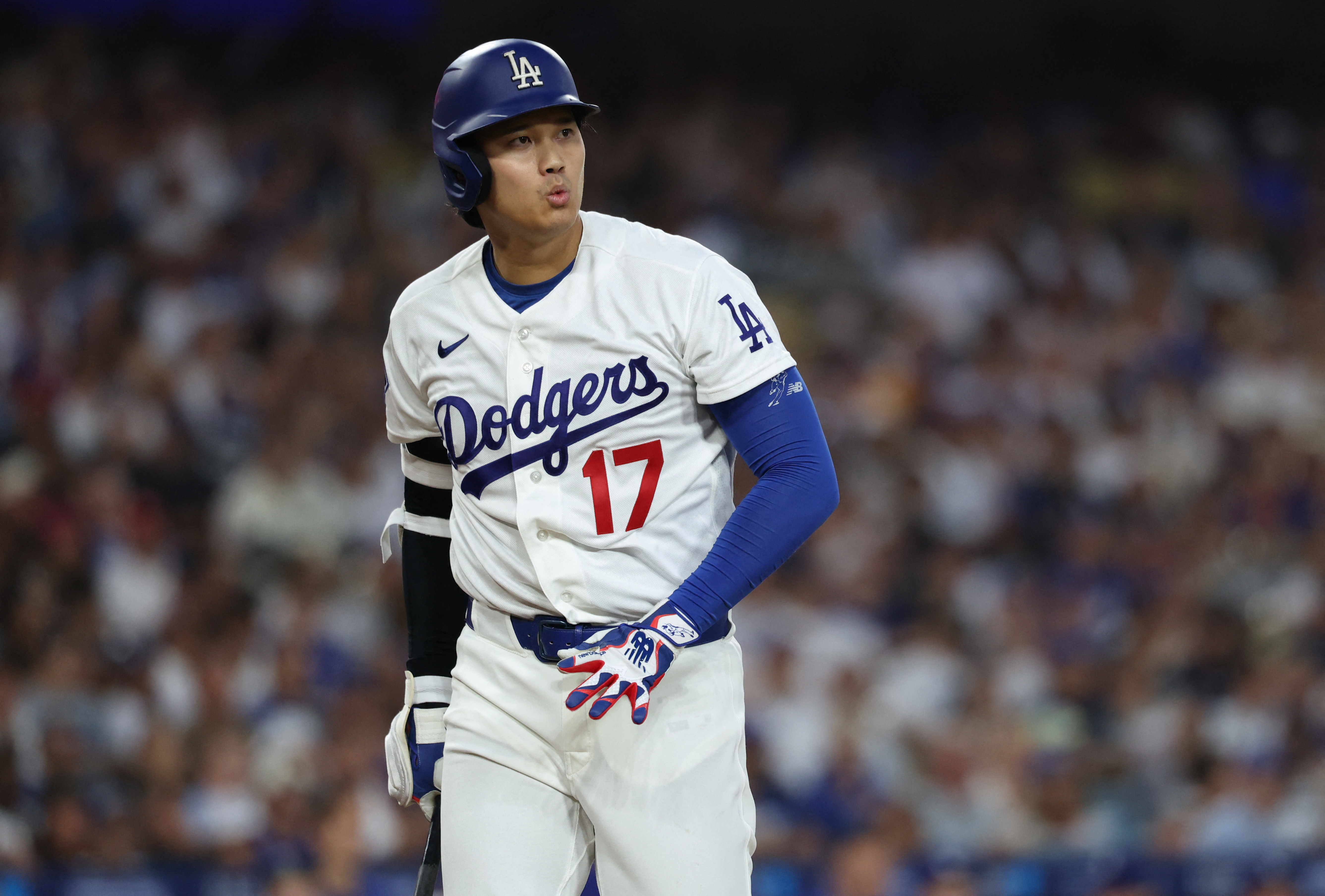 Los Angeles Dodgers designated hitter Shohei Ohtani (17) reacts as we break down our home run predictions.