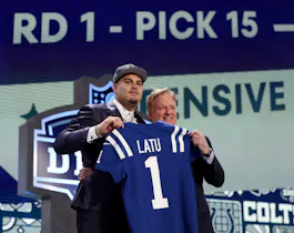 Laiatu Latu poses with NFL Commissioner Roger Goodell as we look at the NFL Defensive Rookie of the Year odds