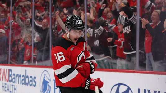 New Jersey Devils center Jack Hughes (86) celebrates as we offer our NHL player props tonight.