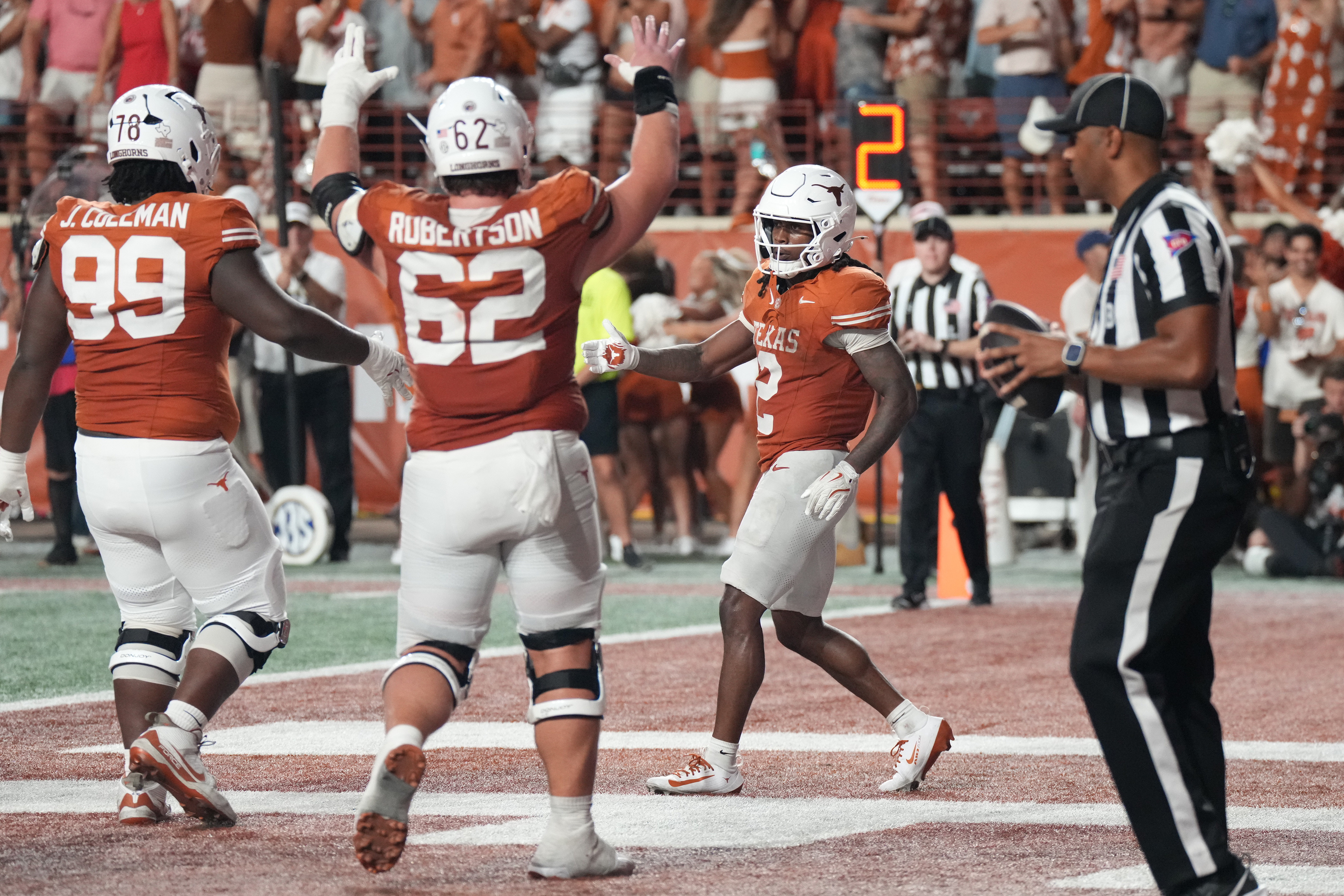 Texas Longhorns running back Hollywood Smothers (2) celebrates after scoring a touchdown as he is featured in our Texas vs. Tennessee touchdown pick.