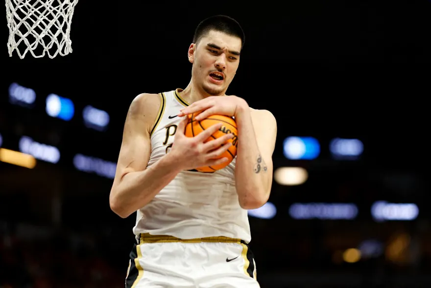 Zach Edey of the Purdue Boilermakers rebounds the ball against the Wisconsin Badgers in the second half at Target Center as we look at our Utah State-Purdue prediction.