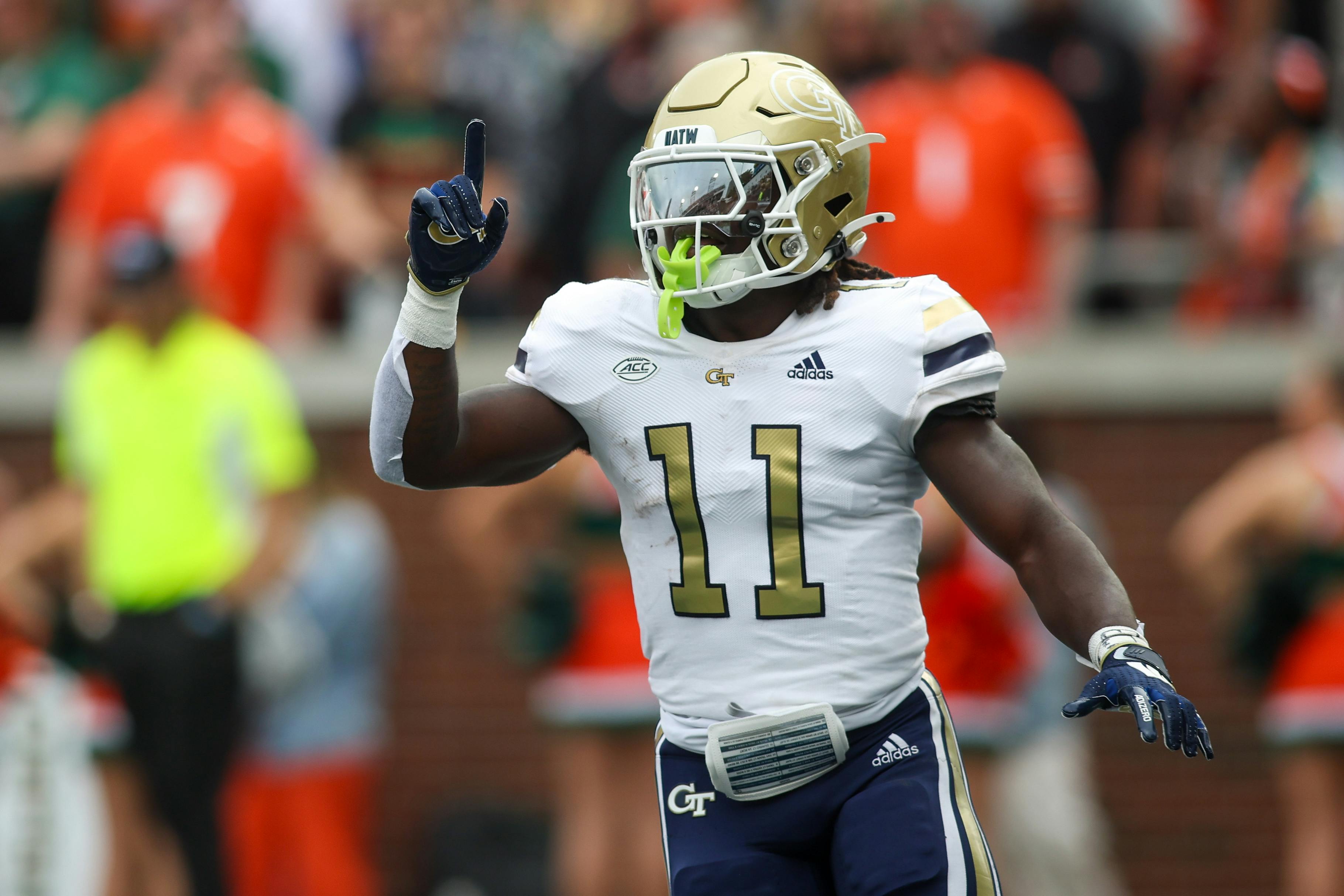 Georgia Tech running back Jamal Haynes reacts after scoring a touchdown against Miami. Georgia Tech is part of our Week 13 college football predictions. 