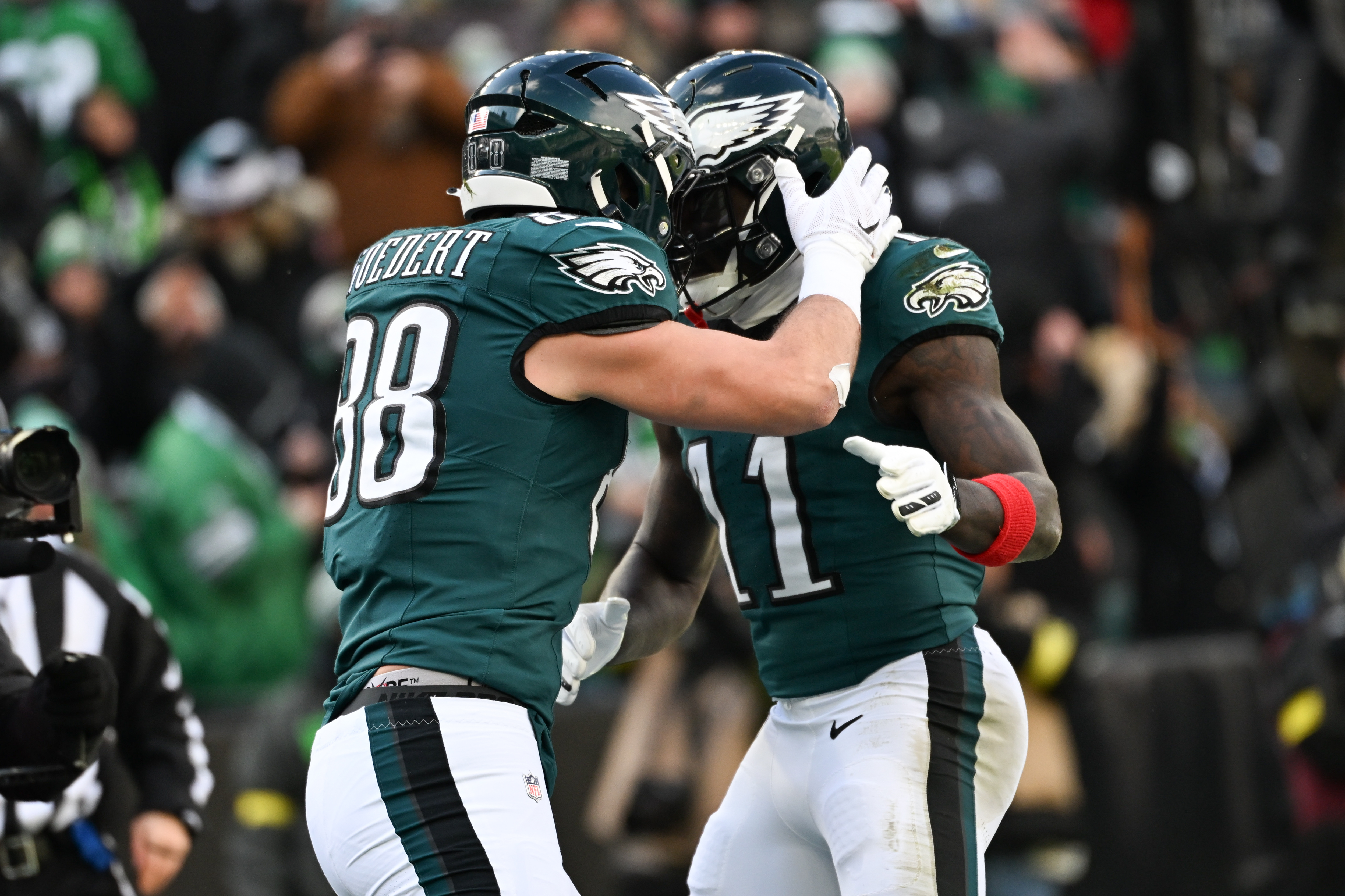 Philadelphia Eagles tight end Dallas Goedert celebrates with wide receiver A.J. Brown - who's featured in our Eagles vs. Commanders predictions - after scoring a touchdown.