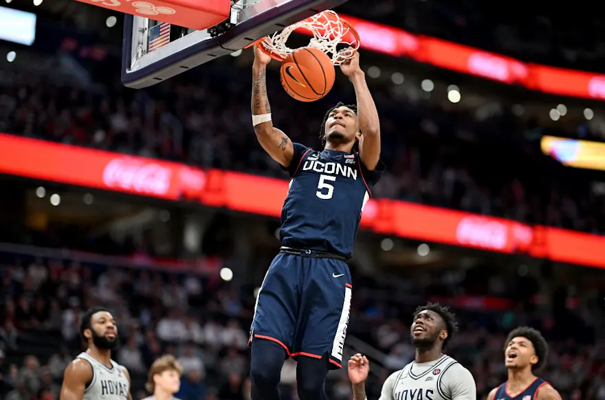 Stephon Castle of the Connecticut Huskies dunks the ball against the Georgetown Hoyas, as we look at the latest 2024 Big East Tournament odds.