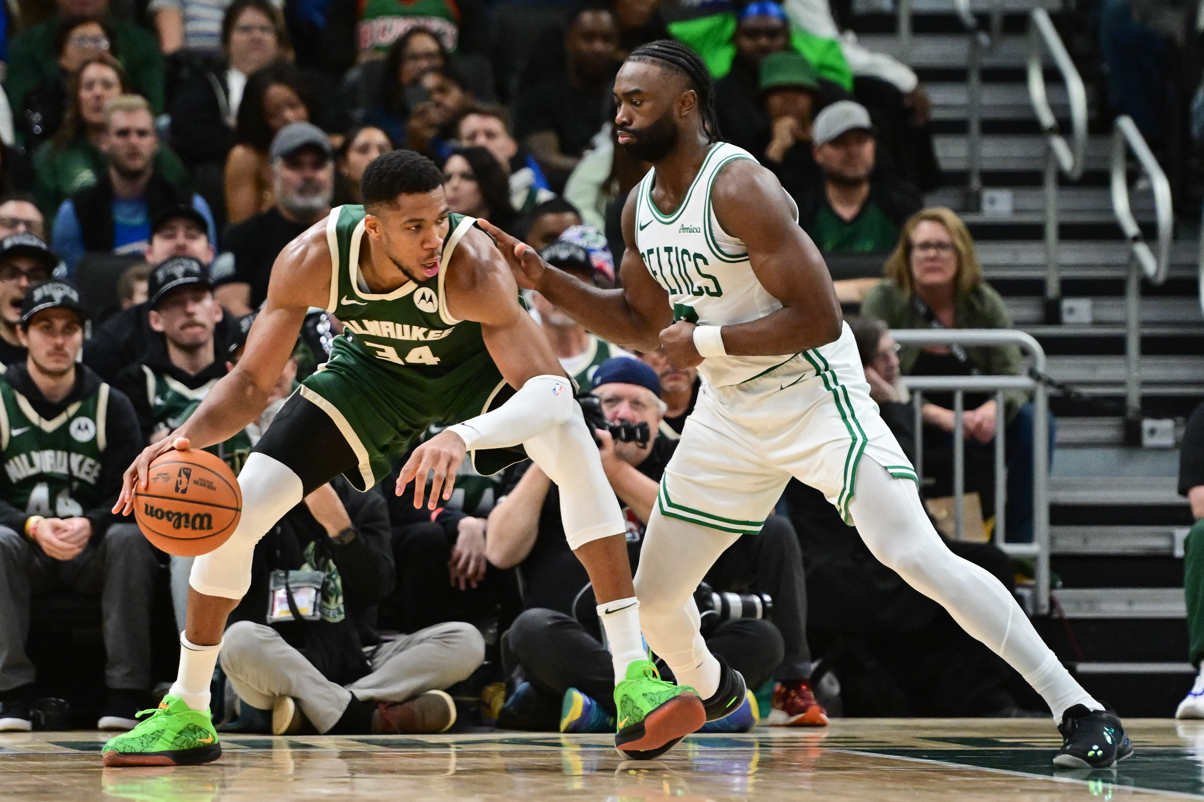 Milwaukee Bucks forward Giannis Antetokounmpo (34) is guarded by Boston Celtics forward Jaylen Brown (7) at Fiserv Forum.