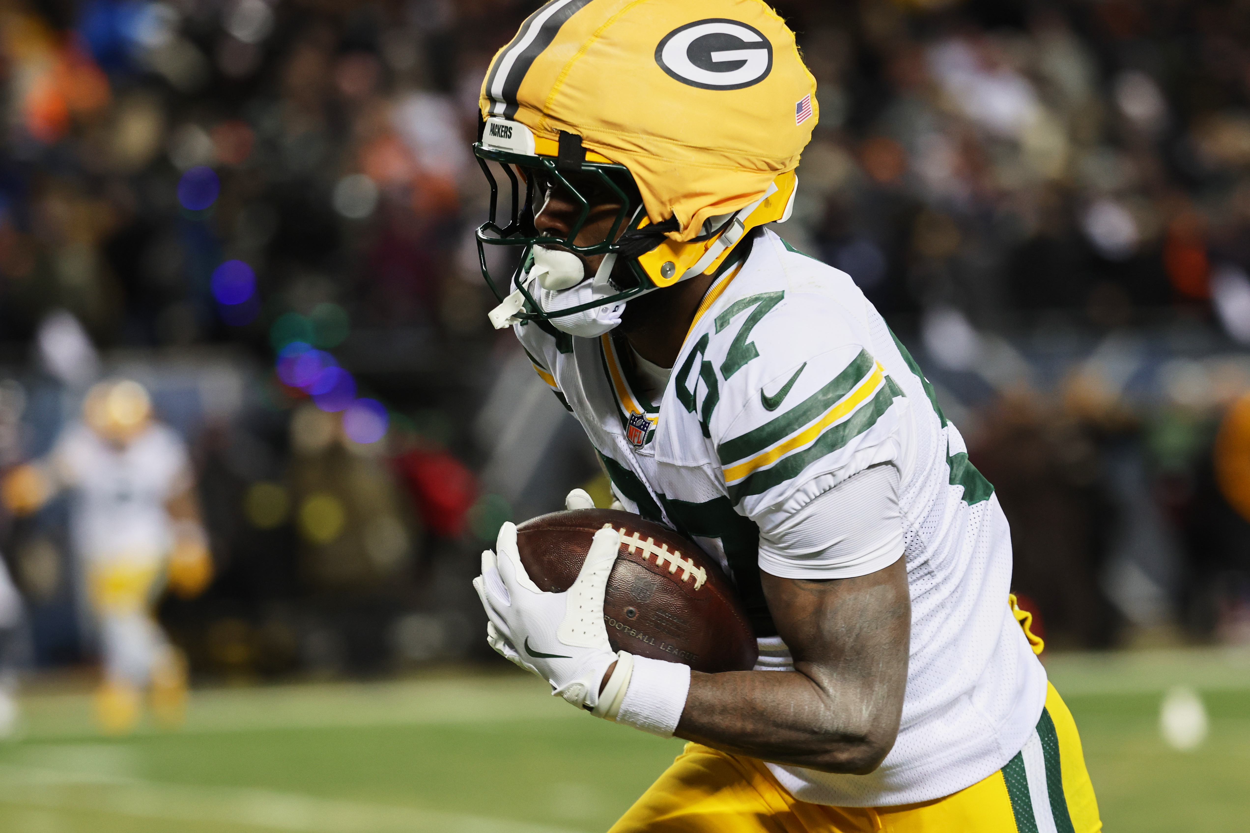 Green Bay Packers wide receiver Romeo Doubs (87) runs for a touchdown as he is featured in our Ravens vs. Packers same-game parlay.