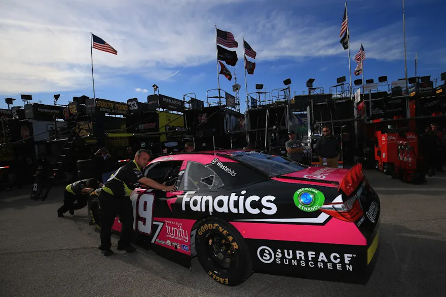 Crew members push the #19 Surface/Fanatics Toyota as we look at the details surrounding the Fanatics Sportsbook and Casino launch in Pennsylvania.