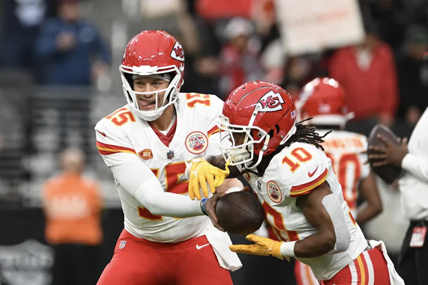 Quarterback Patrick Mahomes #15 hands the ball off to running back Isiah Pacheco as we make our Chiefs vs. Packers prediction for SNF