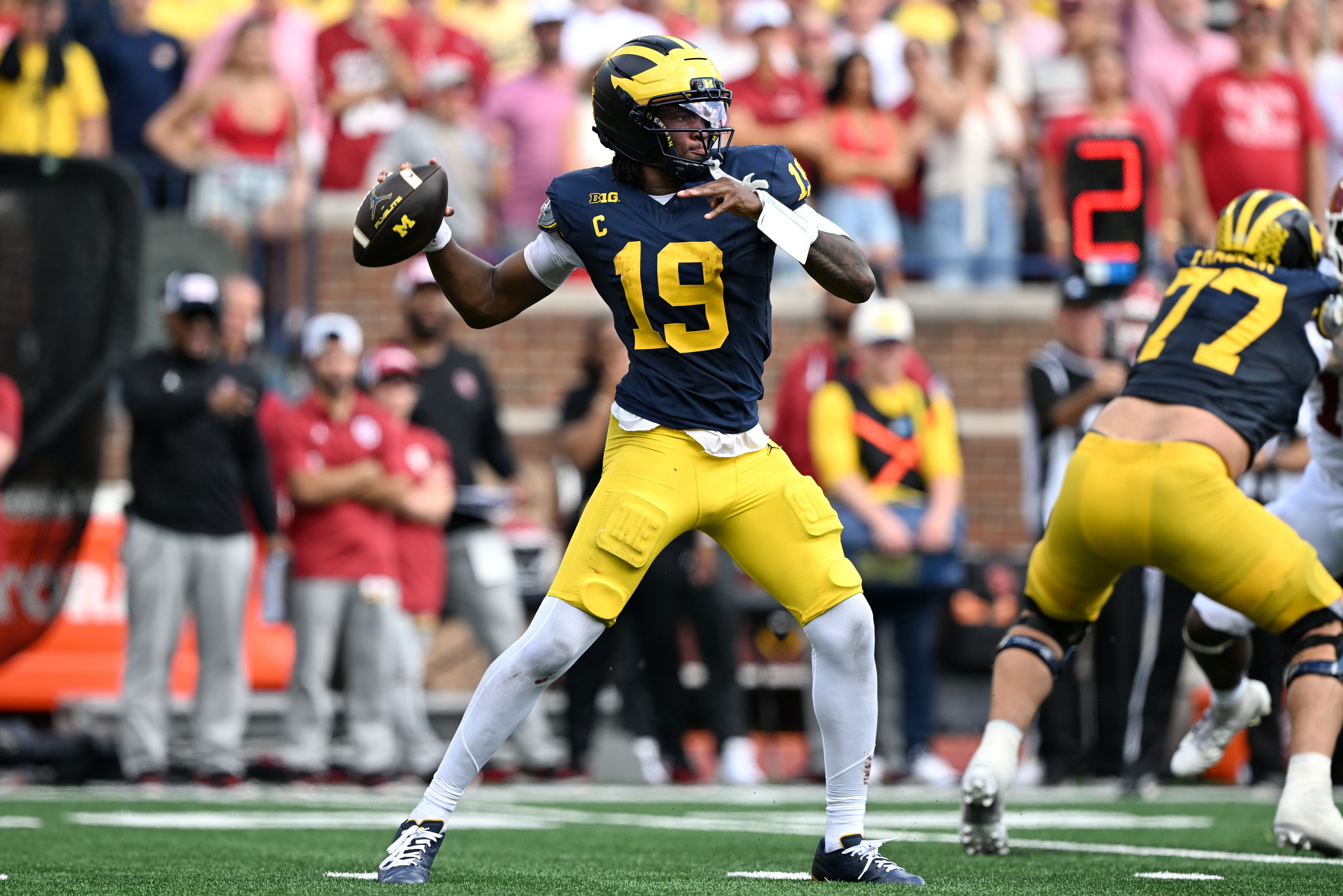 Michigan Wolverines quarterback Bryce Underwood (19) passes the ball as he is featured in our UTEP vs. Michigan prediction.