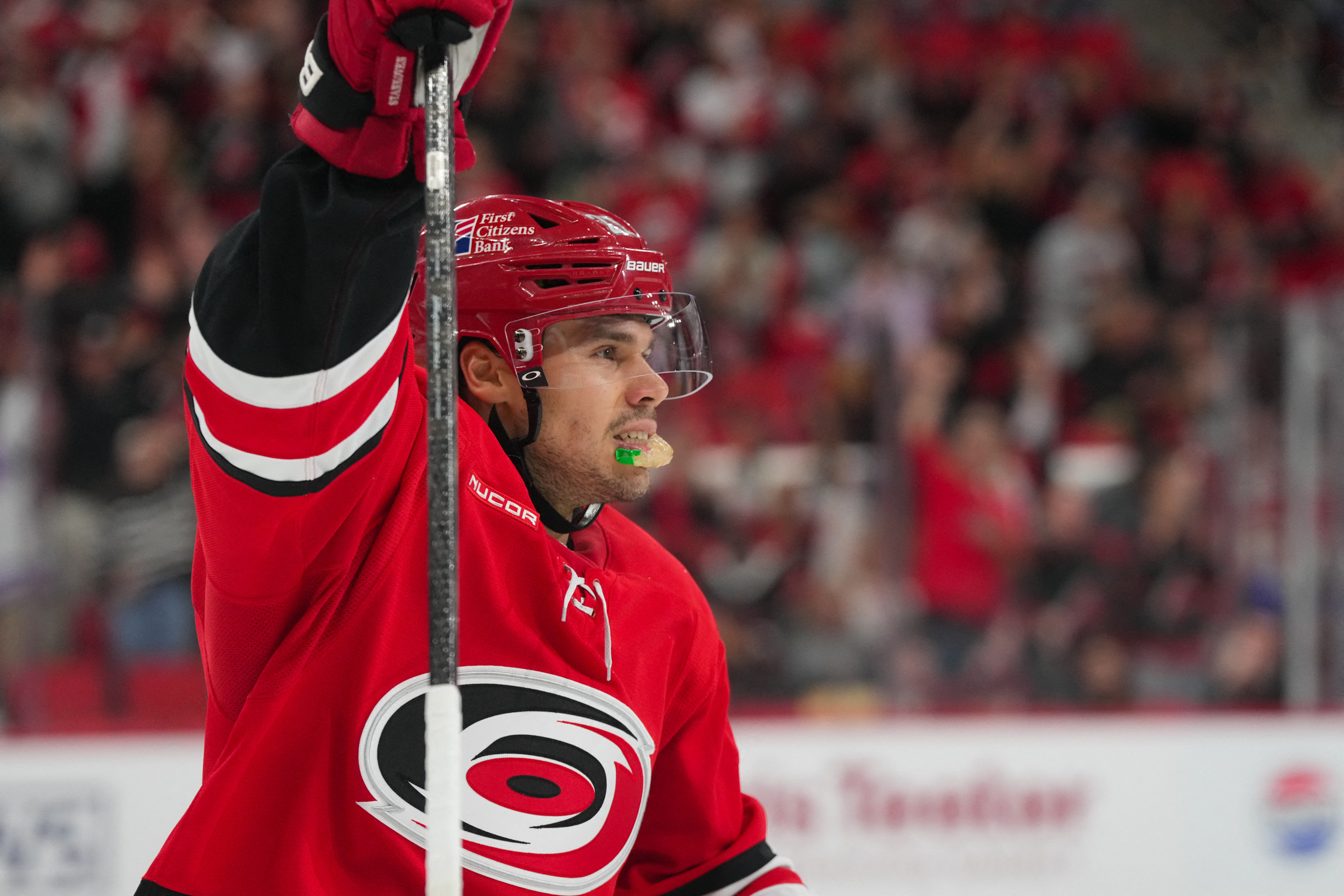 Carolina Hurricanes center Logan Stankoven (22) celebrates a goal as we provide our NHL predictions today.