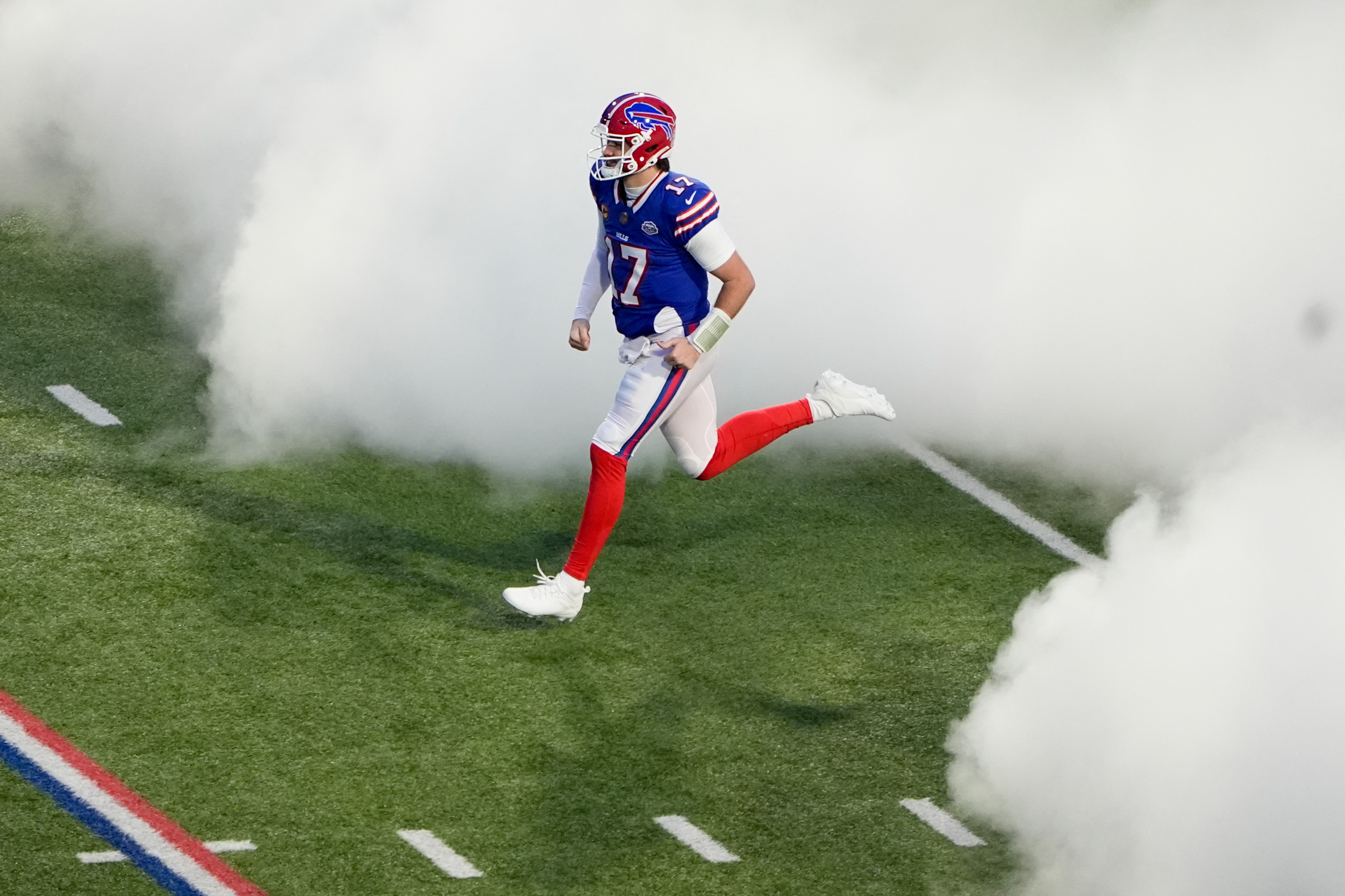 Buffalo Bills quarterback Josh Allen (17) runs onto the field as we break down our Josh Allen vs. Bo Nix player props.