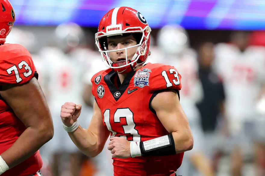 Stetson Bennett of the Georgia Bulldogs reacts after a touchdown during the first half against the Ohio State Buckeyes in the Chick-fil-A Peach Bowl at Mercedes-Benz Stadium.