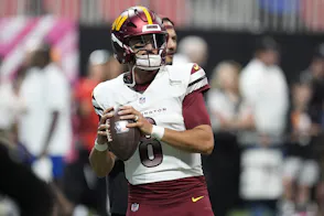 Washington Commanders quarterback Marcus Mariota warms up before a game as we make our Commanders vs. Chiefs player prop bets.