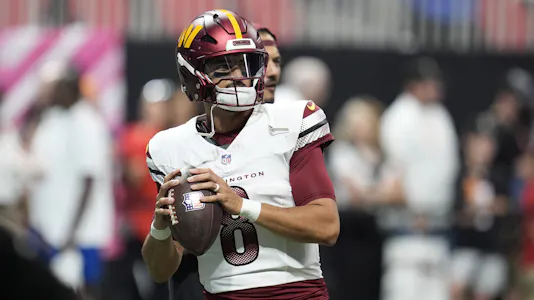 Washington Commanders quarterback Marcus Mariota warms up before a game as we make our Commanders vs. Chiefs player prop bets.